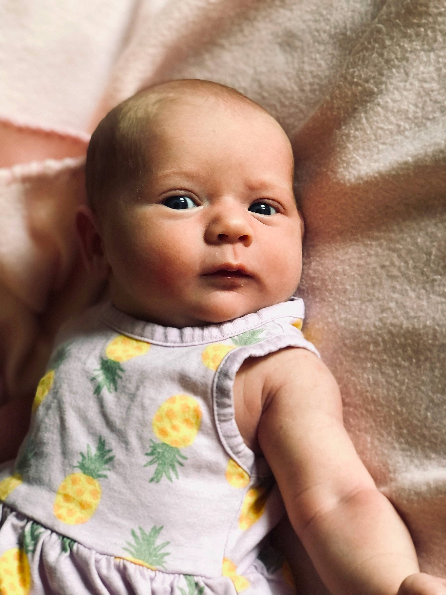 Emmie is registered to the contest to win money with this photo: baby, baby_toddler_clothing, cheek, child, comfort, dress, eye, eyebrow, eyelash, face, head, iris, linens, lip, mammal, nose, person, skin, sleeve, textile