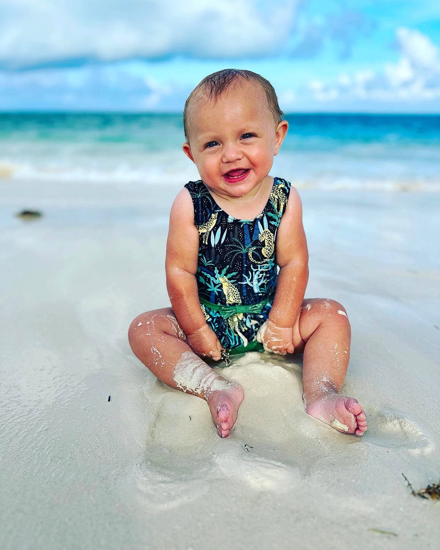 Madilynn joined the competition — help win amazing prizes! aqua, baby, baby_toddler_clothing, beach, cloud, flash_photography, fun, happy, joy, leisure, natural_environment, people_in_nature, people_on_beach, person, sand, skin, sky, smile, summer, toddler