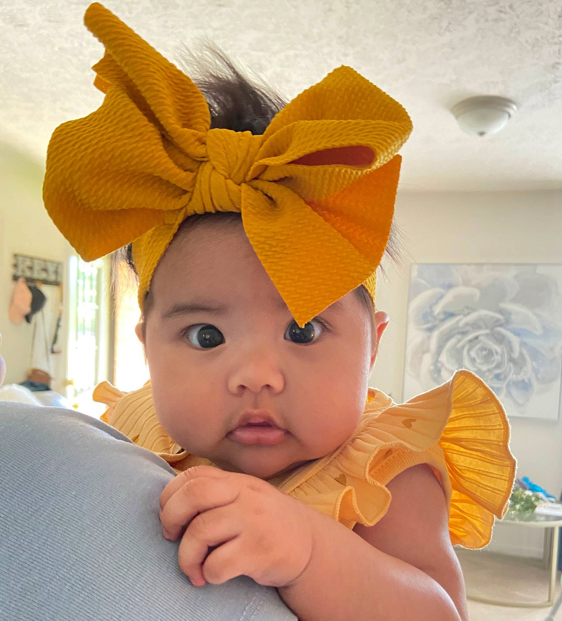 Abi is registered to the contest to win money with this photo: baby, baby_toddler_clothing, cap, comfort, costume_hat, ear, eye, eyelash, fashion_accessory, fun, hair_accessory, happy, headband, headgear, headpiece, headwear, neck, orange, peach, person