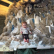Ilah Jo joined the competition — help win amazing prizes! baby, child, smiling, sculpture, plastic, recycled_materials, turtle, outdoor, art, installation, footwearless, clothing, creative, environment, daylight, concrete, netting, texture, playful, happy