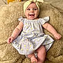 baby, infant, smiling, headband, dress, blanket, wooden_blocks, milestone, 5_months, cute, happy, lying_down, indoors, skin, foot, hand, face, apparel, child, portrait