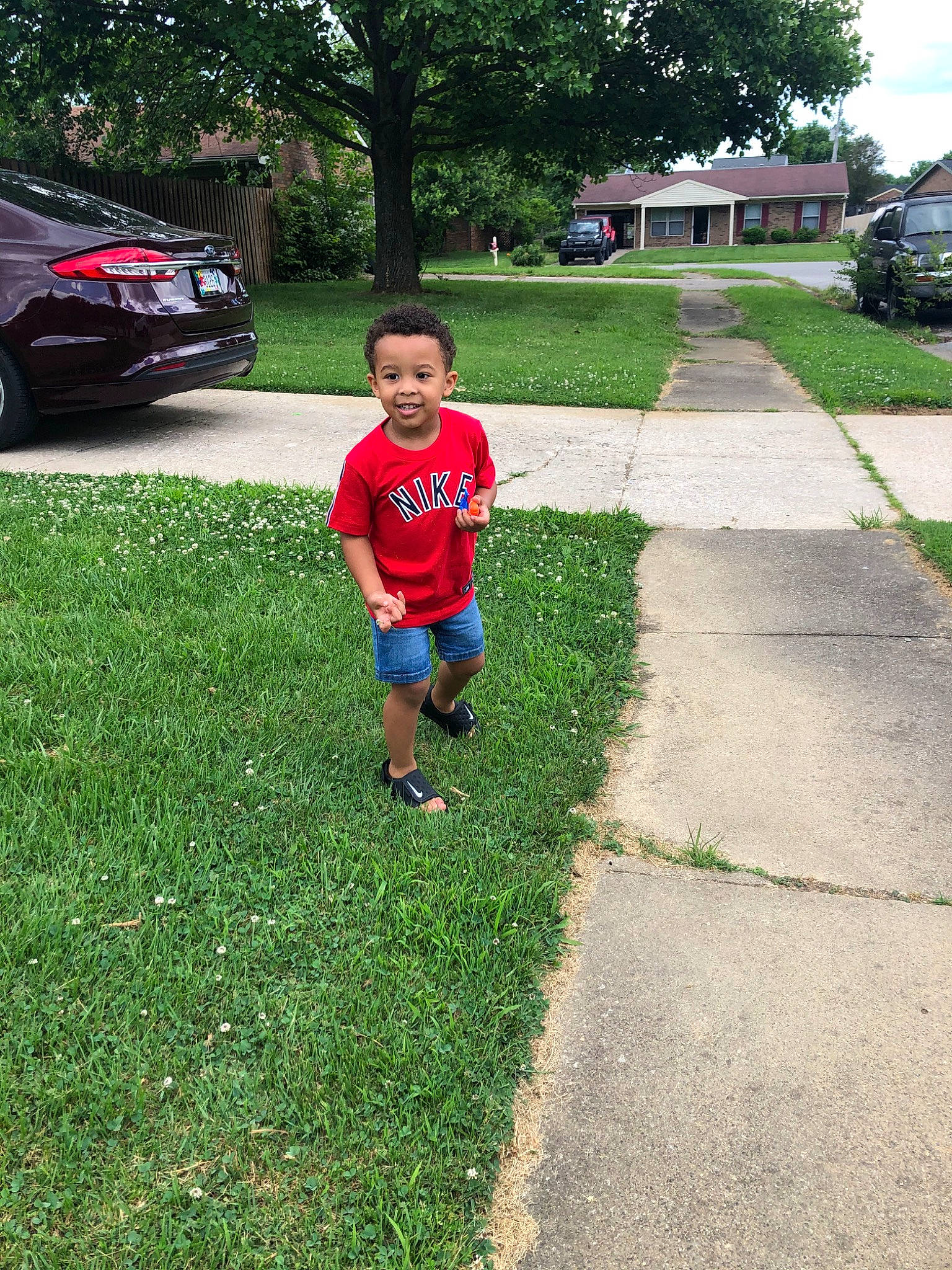 Kaynan joined the competition — help win amazing prizes! car, child, family_car, garden, grass, home, house, joy, lawn, leisure, person, plant, recreation, road, sidewalk, summer, toddler, tree, vacation, vehicle