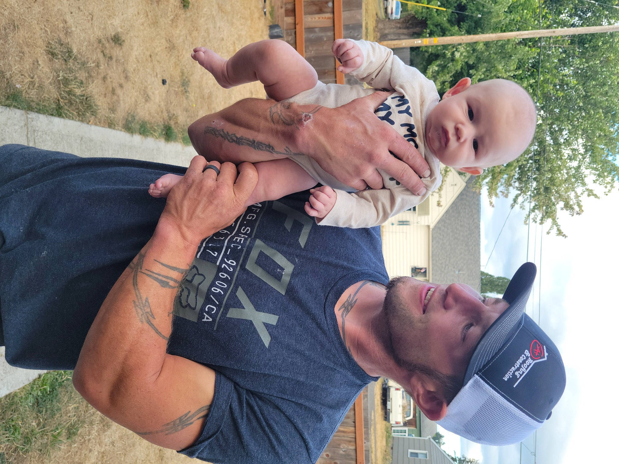 Emmitt William is registered to the contest to win money with this photo: arm, clothing, elbow, eyewear, gesture, hand, happy, hat, headwear, joint, leisure, muscle, people, person, photograph, plant, shorts, sky, summer, t_shirt