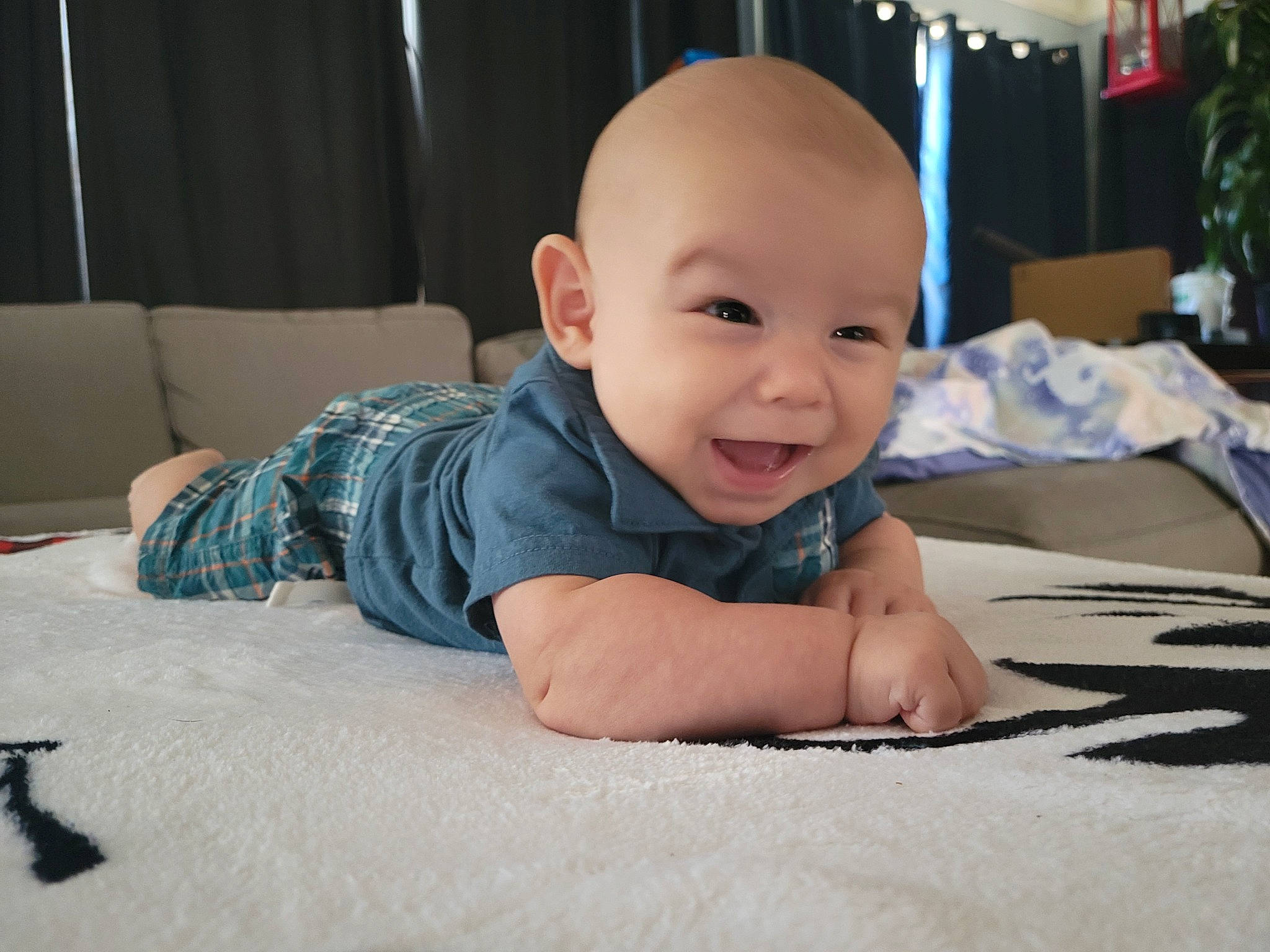 Emmitt William joined the competition — help win amazing prizes! baby, baby_toddler_clothing, cheek, chin, comfort, crawling, eye, flash_photography, floor, flooring, hairstyle, happy, head, houseplant, iris, person, skin, smile, standing, toddler