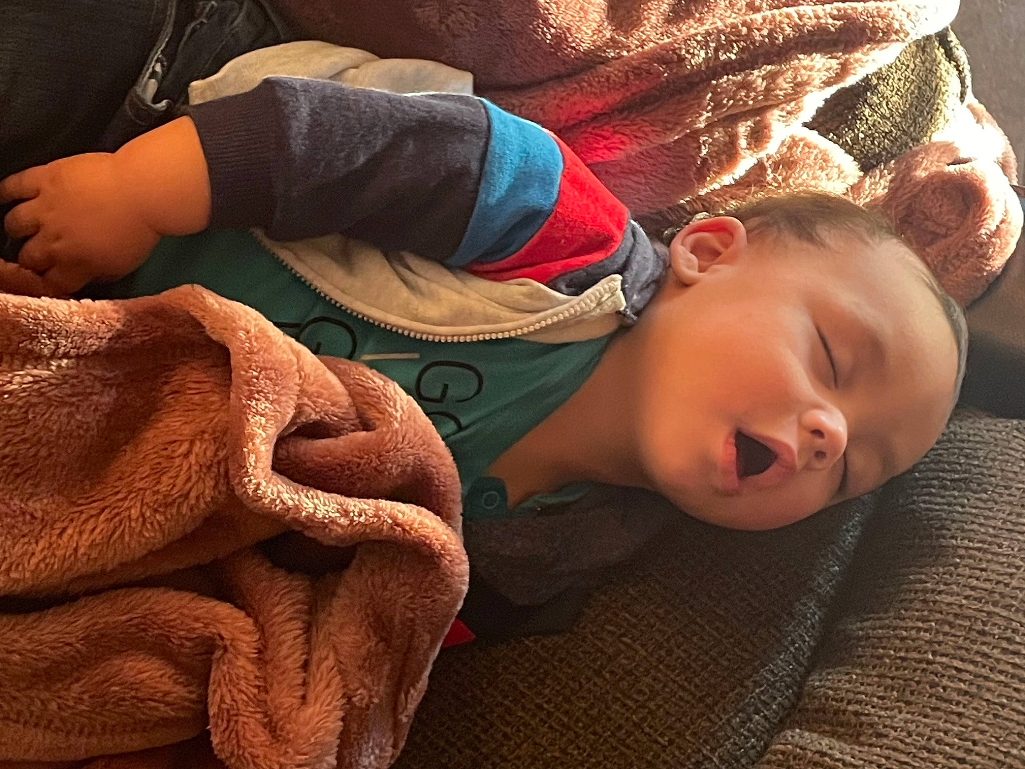 Trey joined the competition — help win amazing prizes! cheek, child, comfort, elbow, finger, flooring, hand, happy, head, human_leg, linens, mouth, nose, person, red, sitting, skin, sleeve, textile, toddler