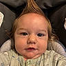 Elias joined the competition — help win amazing prizes! baby, child, face, hair, mohawk, onesie, infant, blue_eyes, cute, portrait, smiling, clothing, indoor, seat, cushion, closeup, skin, young, person, happy