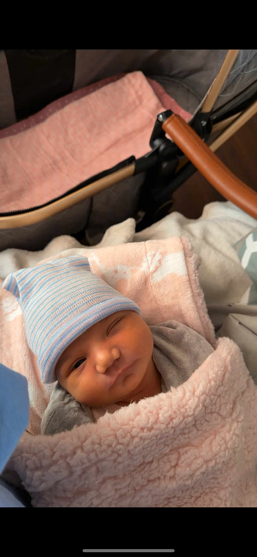 Anastasia joined the competition — help win amazing prizes! newborn, baby, blanket, hat, stroller, cozy, infant, sleepy, cute, soft, pastel, wrapped, child, portrait, face, clothing, babycare, resting, winking, indoors