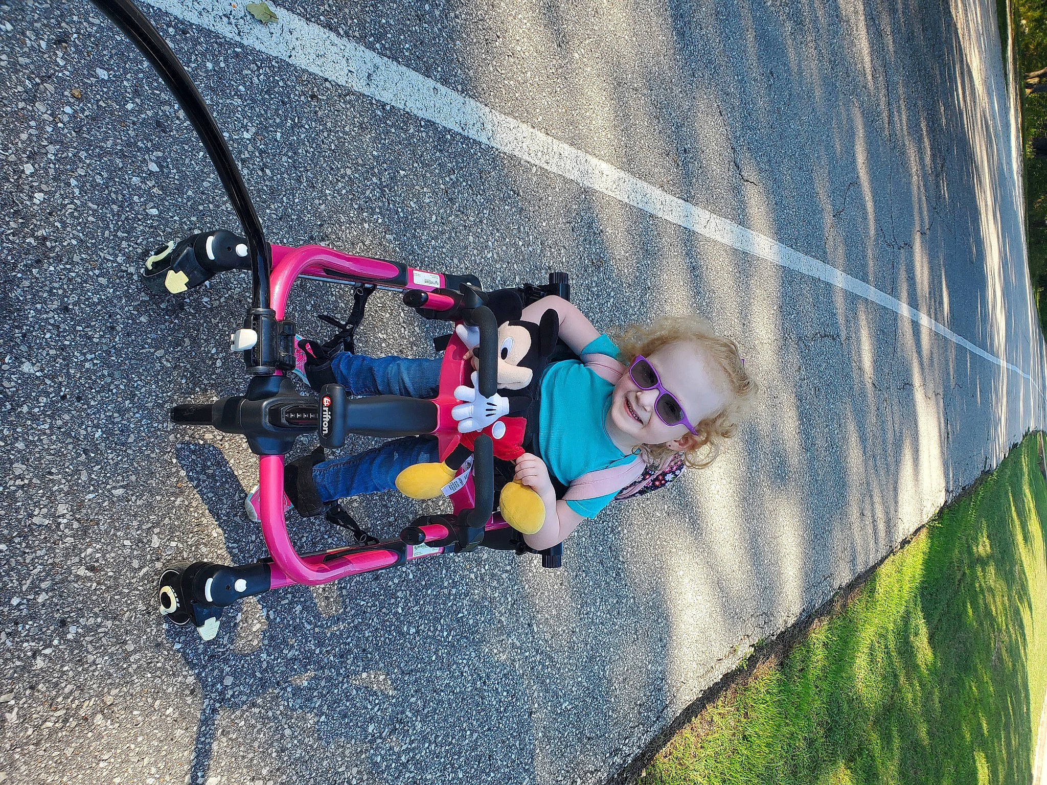Amber is registered to the contest to win money with this photo: adventure, asphalt, baby, baby_carriage, baby_products, child, city, electric_blue, fun, grass, joy, leisure, motor_vehicle, person, personal_protective_equipment, plant, recreation, road_surface, shadow, sidewalk