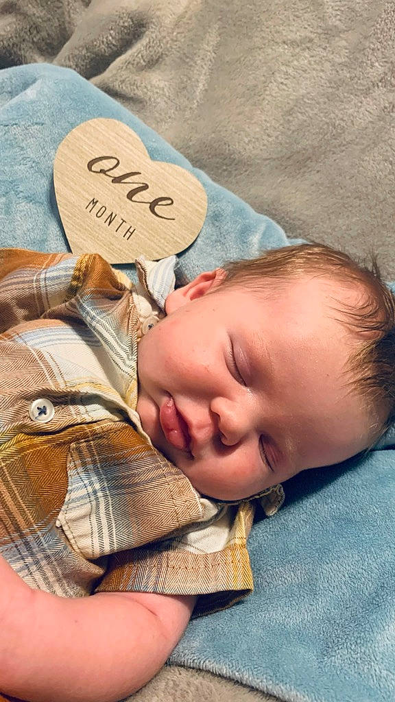 Benjamin is registered to the contest to win money with this photo: baby, baby_products, baby_sleeping, baby_toddler_clothing, bedtime, cheek, child, comfort, grass, happy, linens, nap, pattern, person, room, sitting, sleep, textile, toddler, tree