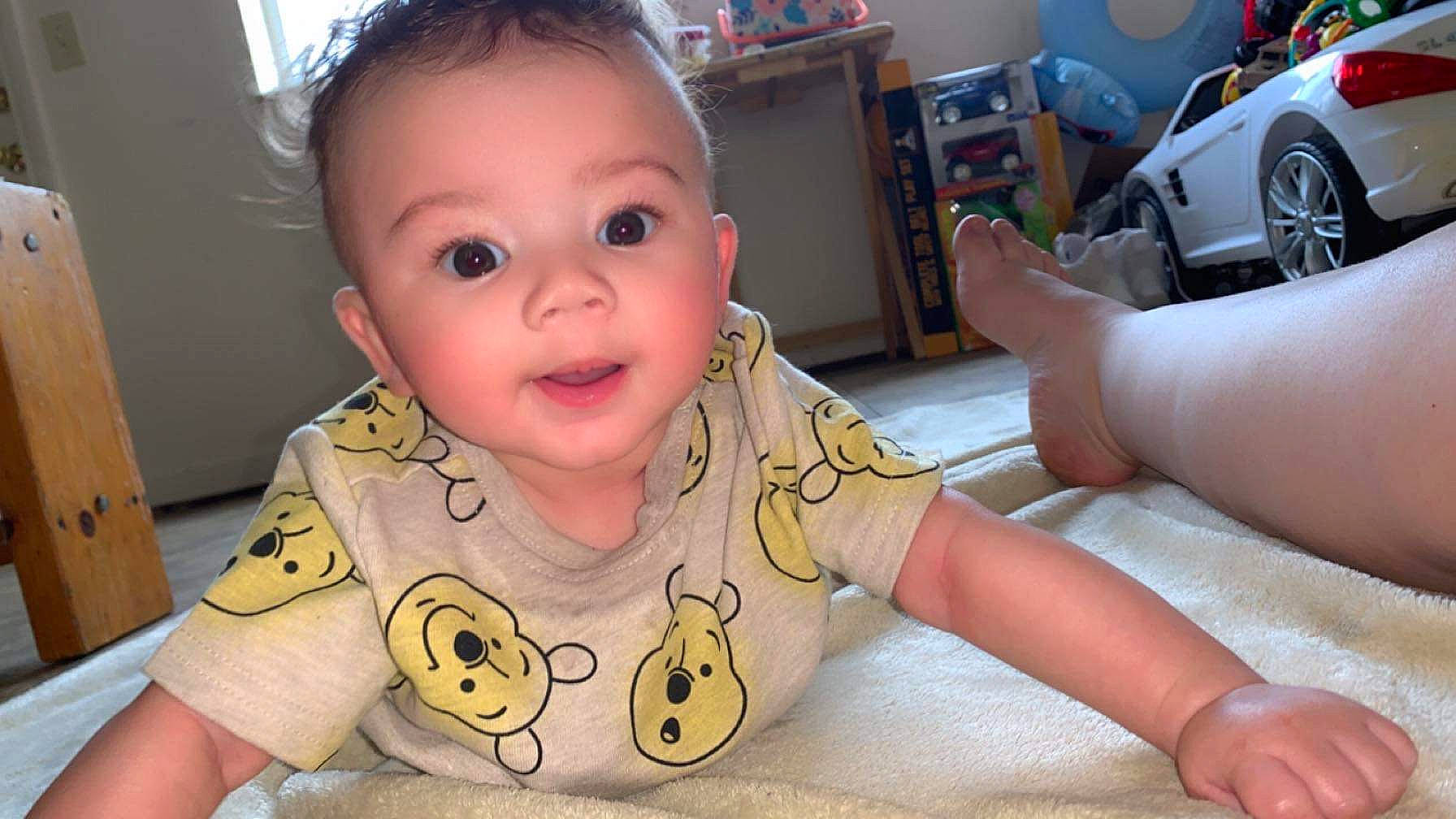 Drayden joined the competition — help win amazing prizes! arm, baby_toddler_clothing, cheek, chin, eye, eyebrow, eyelash, face, finger, fun, happy, head, iris, mouth, nose, person, skin, smile, tire, toddler