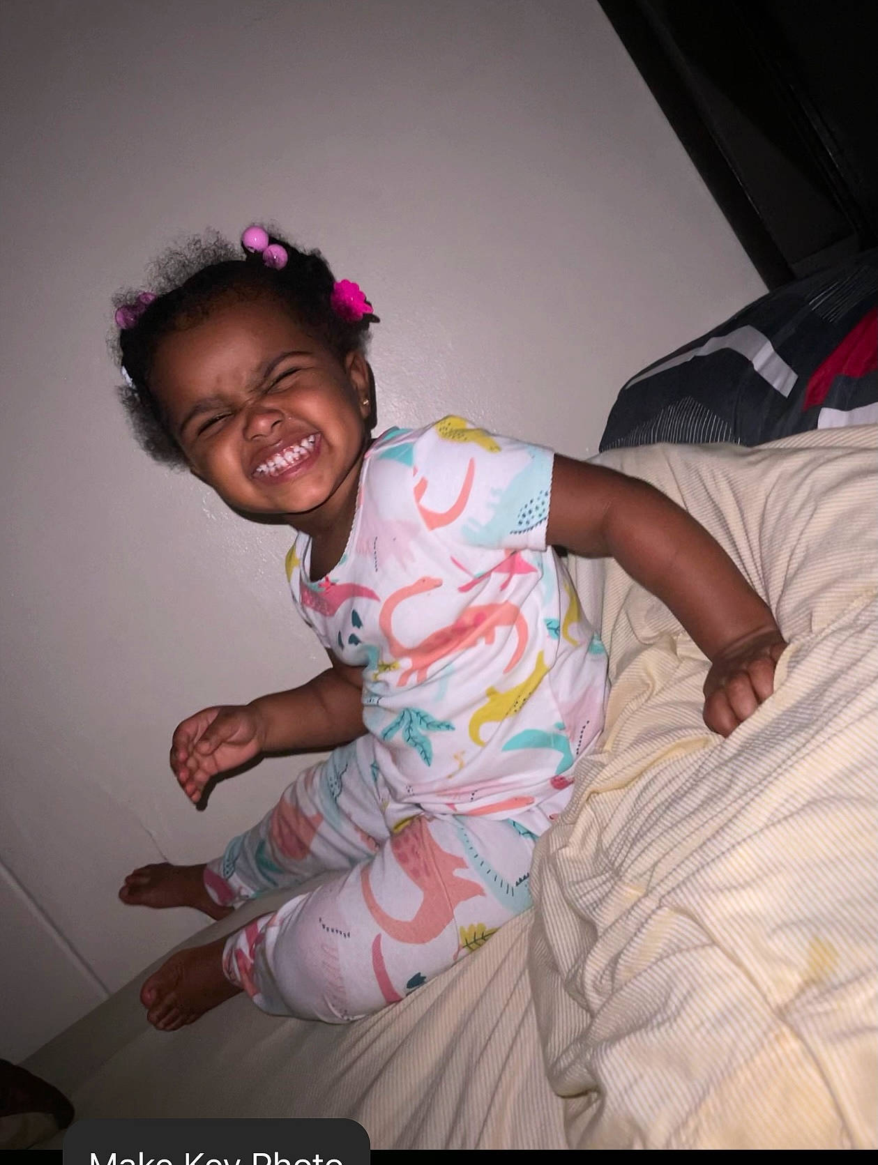 Rylynn is registered to the contest to win money with this photo: baby, baby_toddler_clothing, child, comfort, cool, darkness, face, flash_photography, fun, happy, human_leg, joy, linens, magenta, person, pink, room, sitting, skin, sleeve