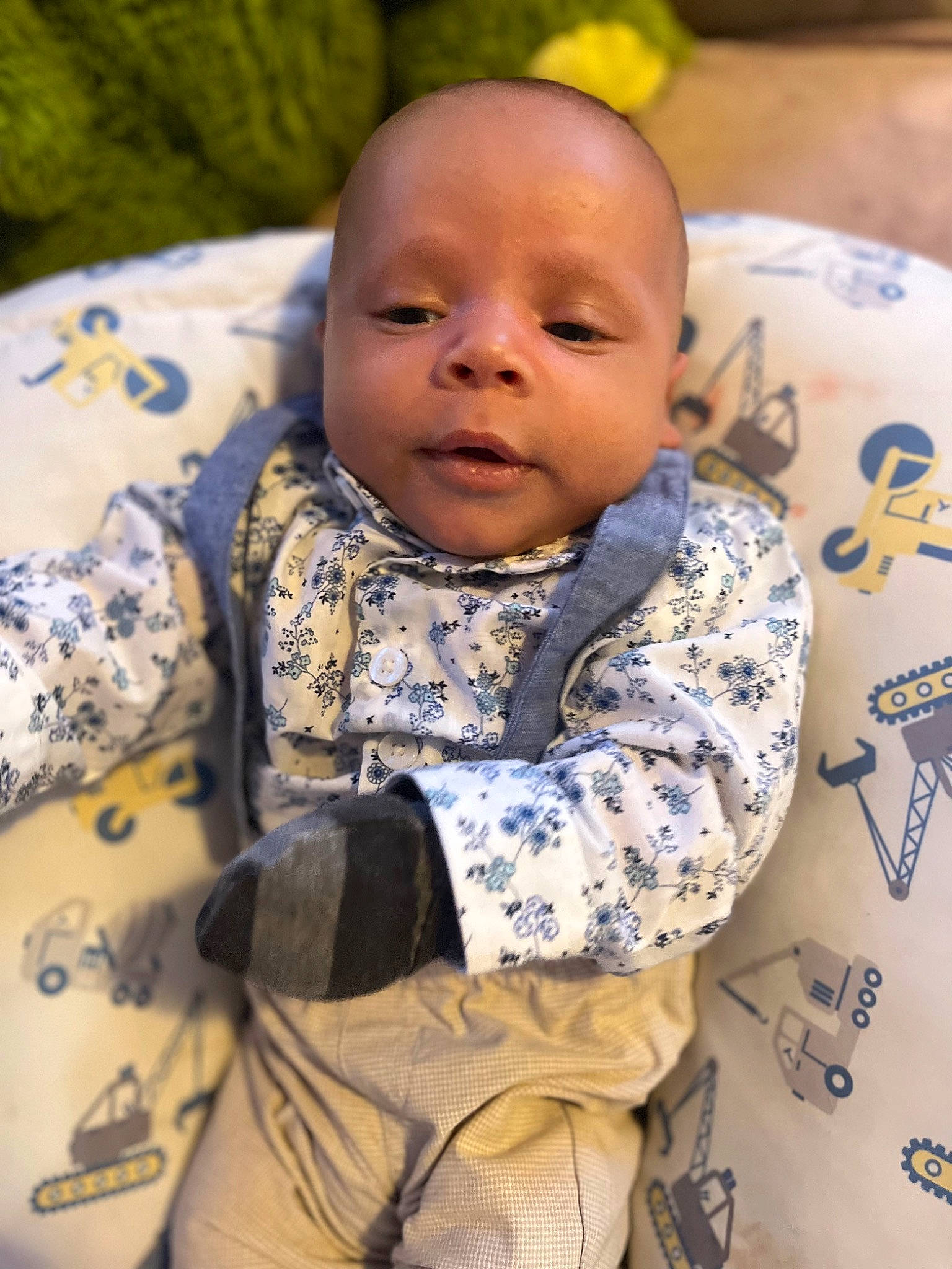 Zakai is registered to the contest to win money with this photo: baby, baby_products, baby_toddler_clothing, bib, cheek, child, comfort, event, eye, fun, happy, head, linens, pattern, person, room, sitting, skin, sleeve, textile