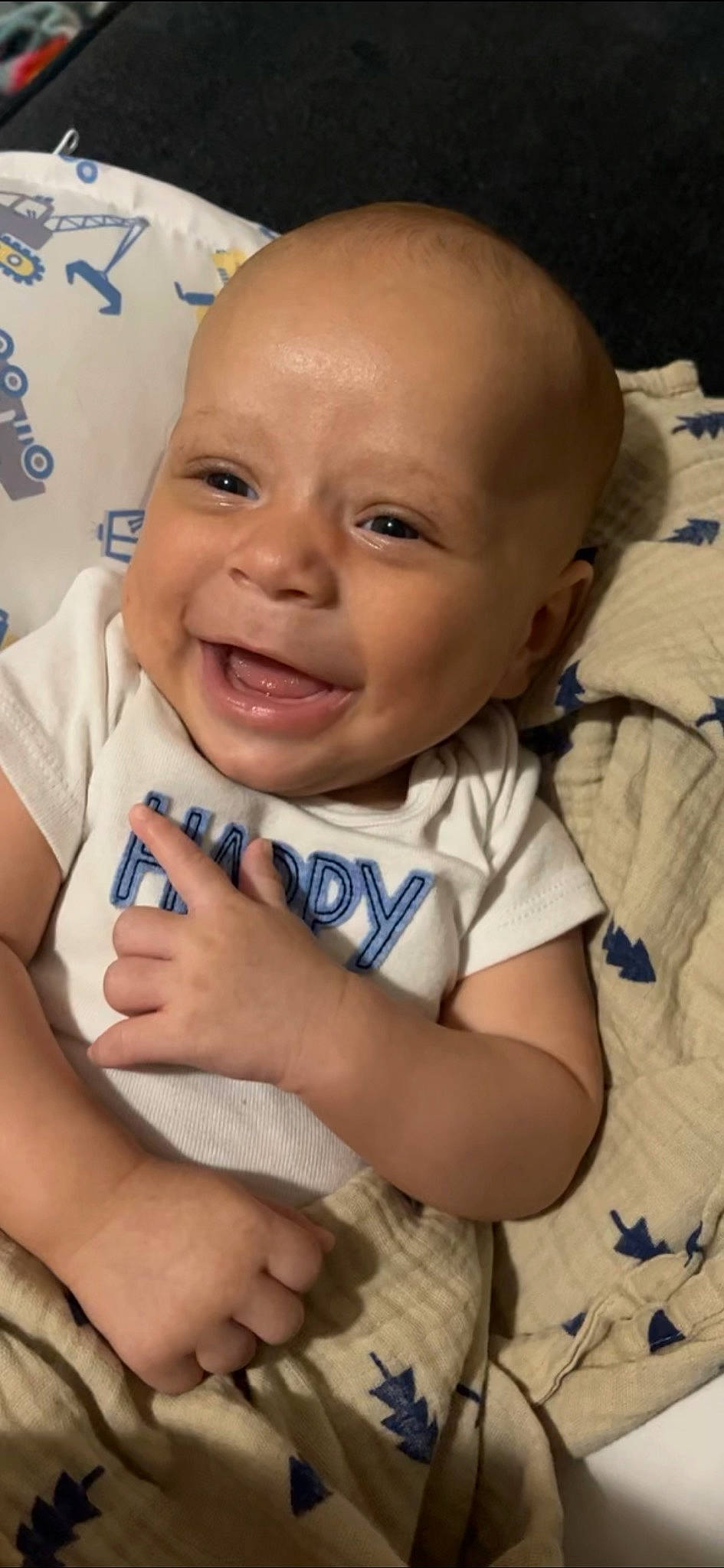 Zakai joined the competition — help win amazing prizes! arm, baby_toddler_clothing, cheek, chin, comfort, eye, eyebrow, face, finger, gesture, happy, head, iris, lip, mouth, nose, person, skin, sleeve, smile