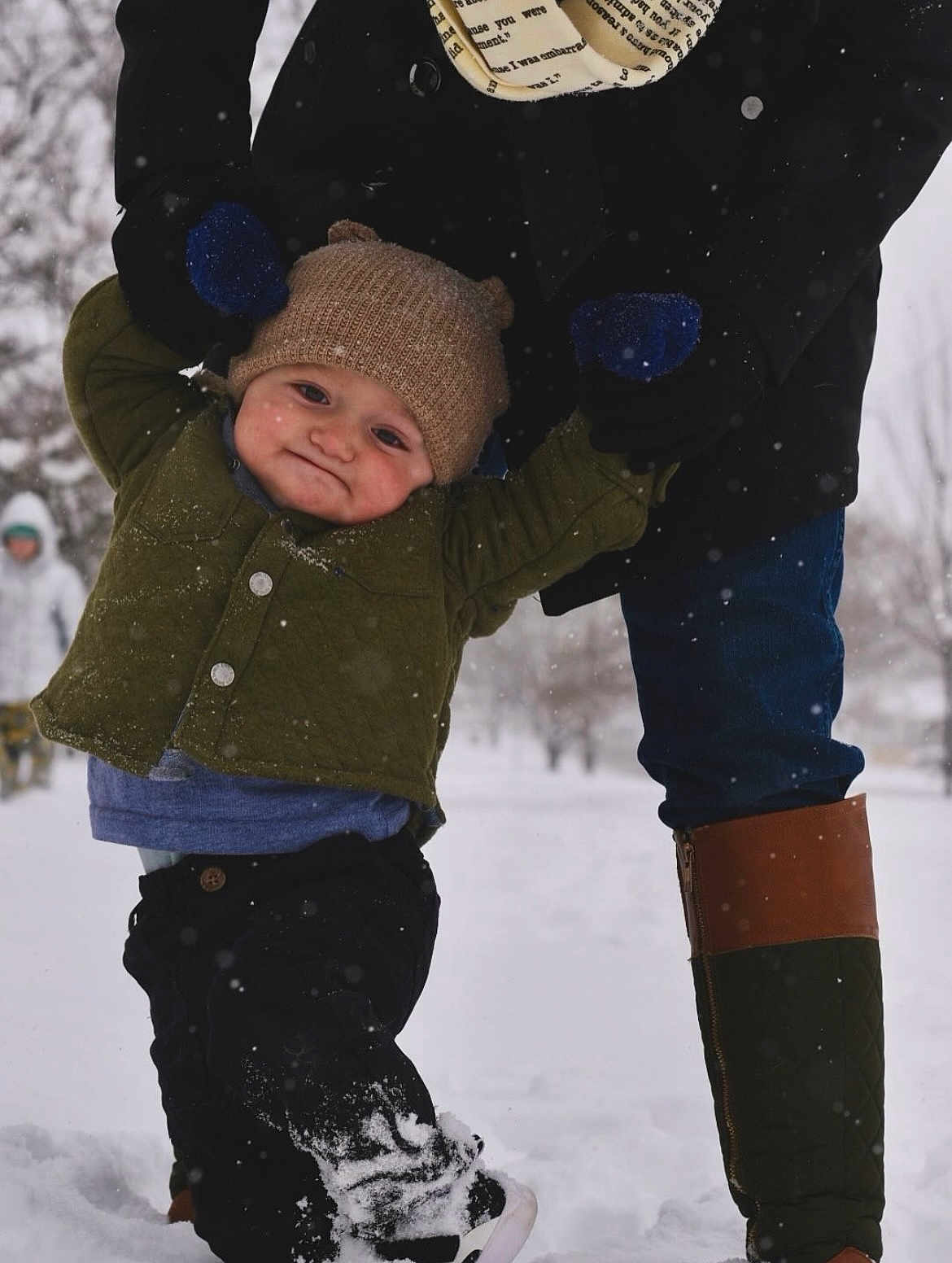 Henry joined the competition — help win amazing prizes! child, toddler, beanie, mittens, snow, winter_coat, boots, adult, legs, snowflakes, park, outdoor, smile, happy_face, quilted_jacket, walking, playing, parent_and_child, cold_weather, portrait