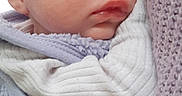 Ambre participe au concours pour gagner de l'argent avec cette photo : baby, sleeping, headband, red, face, closeup, cozy, knit, purple, soft, cute, infant, child, clothing, warm, rest, peaceful, portrait, wrapped, newborn