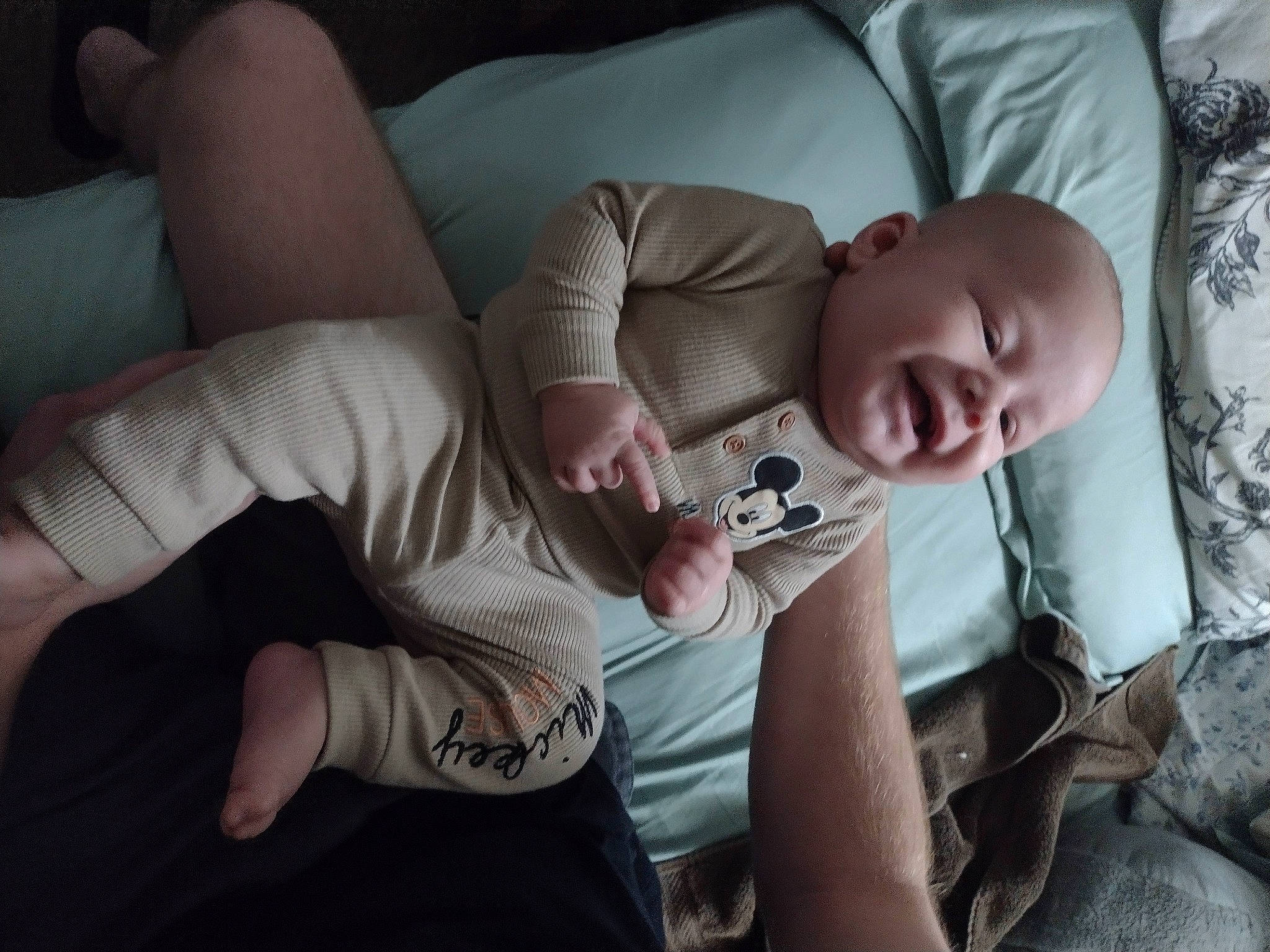 Henry is registered to the contest to win money with this photo: abdomen, baby, chest, child, comfort, couch, elbow, finger, flash_photography, flesh, human_leg, knee, linens, mouth, neck, person, room, sitting, skin, thigh