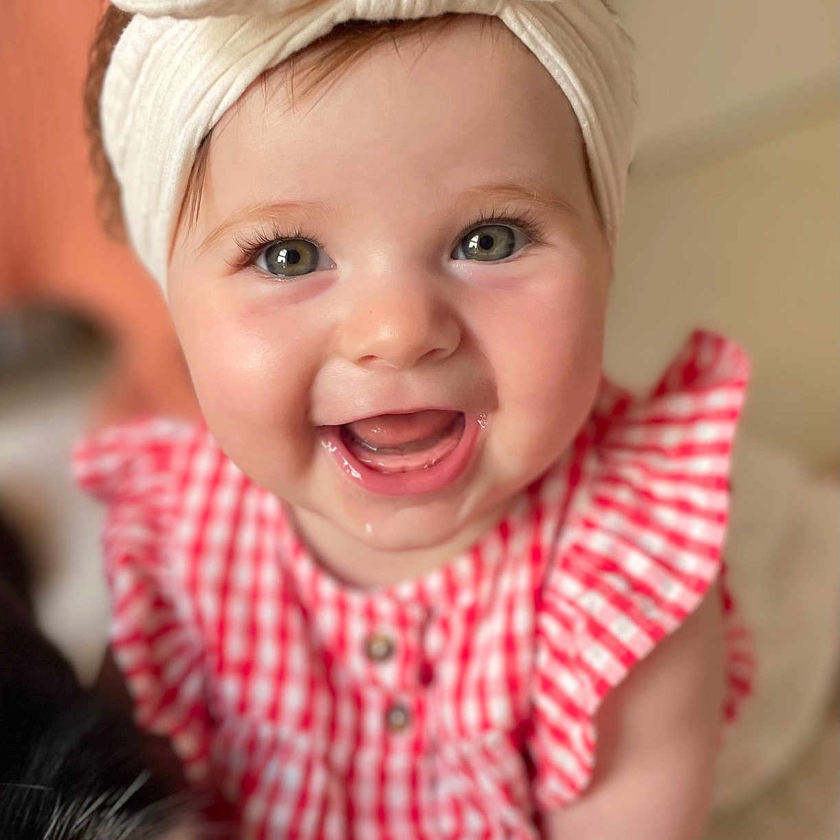 Jade participe au concours pour gagner de l'argent avec cette photo : baby, bunny_ears, cheeks, child, closeup, clothing, cute, eyes, face, happy, headband, indoors, infant, mouth, portrait, red_checkered_dress, skin, smiling, soft_light, teeth