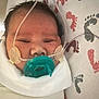 baby, newborn, pacifier, oxygen_tube, hospital, blanket, footprints, medical, infant, face, swaddled, cute, healthcare, child, patient, hospital_bed, tubes, nasal_cannula, resting, wrapped