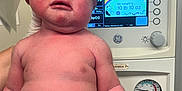 Thaddeus is registered to the contest to win money with this photo: newborn, baby, infant, hospital, medical_equipment, gloves, person, face, skin, hand, foot, monitor, weight, pressure_gauge, healthcare, clinic, child, human, crying, naked