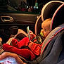 Amelia is registered to the contest to win money with this photo: baby, car_door, car_interior, car_seat, casual_clothing, child, curious, hand, indoors, infant, night, pacifier, portrait, red_tights, reflection, safety, seat, seatbelt, smartphone, window