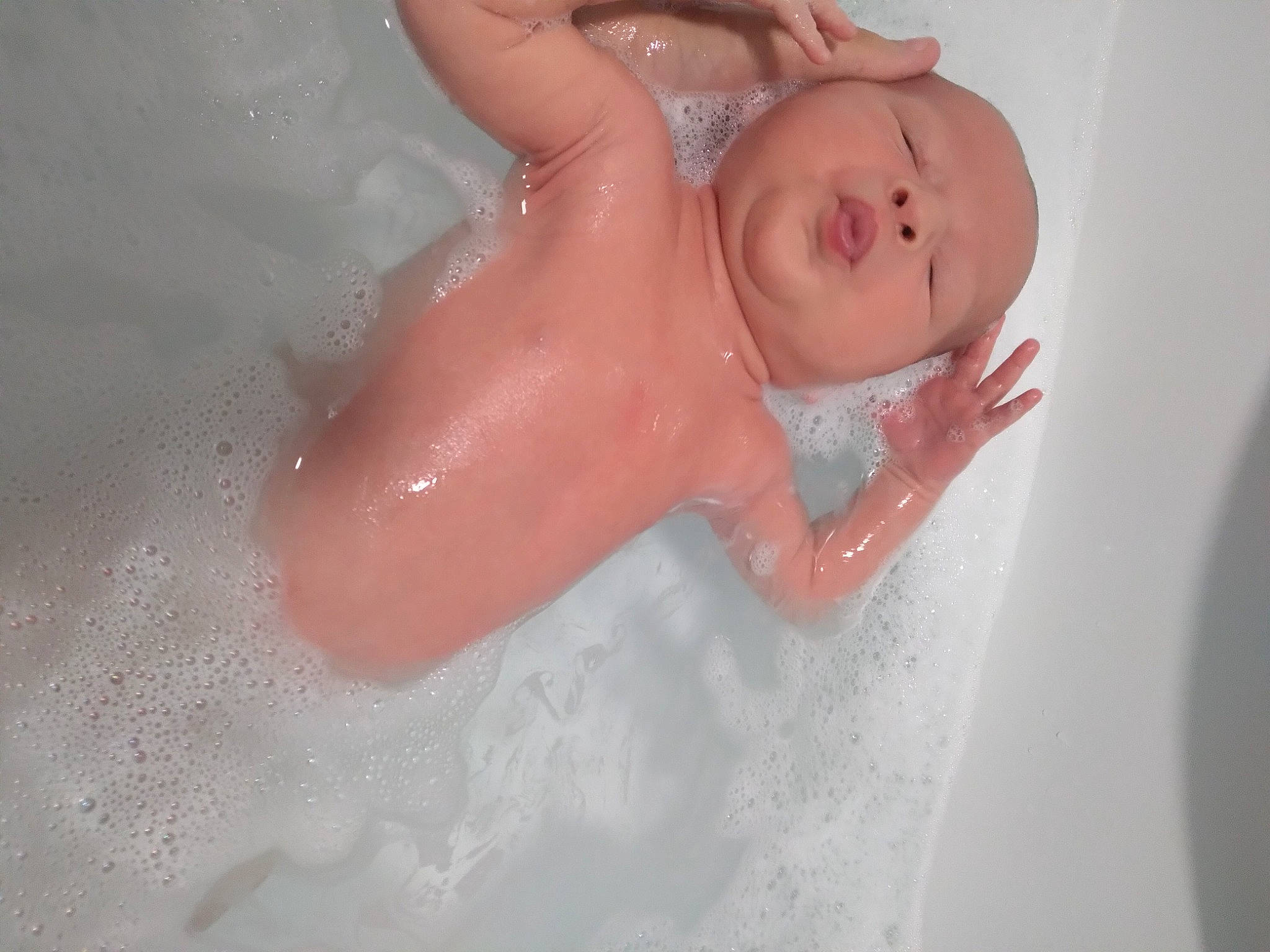 Charlie is registered to the contest to win money with this photo: baby_bathing, barechested, bathing, bathroom, bathtub, chest, elbow, eye, fluid, foam, fun, hair, human_body, liquid, neck, nose, person, plumbing, plumbing_fixture, trunk
