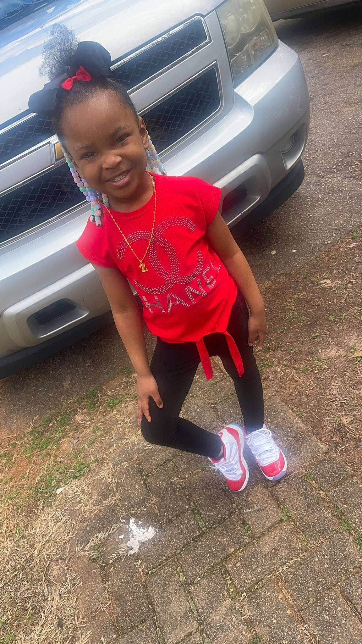 Zamiyah joined the competition — help win amazing prizes! automotive_design, automotive_exterior, automotive_fog_light, automotive_lighting, automotive_tail_brake_light, automotive_tire, automotive_wheel_system, bumper, car, fender, grille, hood, joy, land_vehicle, light, motor_vehicle, parking, person, tire, toddler