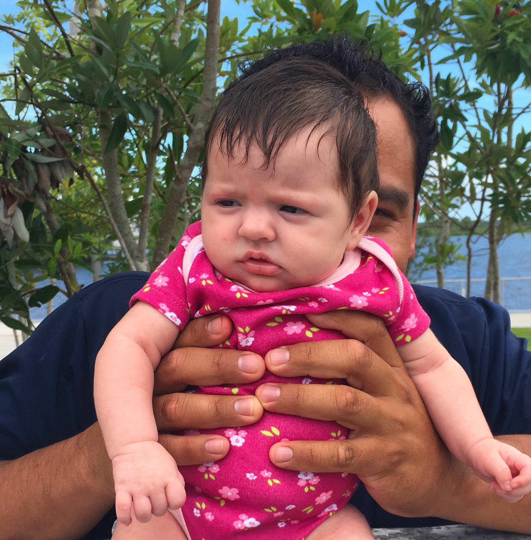 Allyson is registered to the contest to win money with this photo: arm, baby, baby_toddler_clothing, beauty, cheek, chest, facial_expression, finger, gesture, grass, hand, happy, leisure, nose, people_in_nature, person, plant, skin, sky, thumb