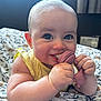 Willow joined the competition — help win amazing prizes! baby, child, toy, chewing, blue_eyes, chubby, blanket, floral_pattern, yellow_clothing, indoor, cute, smiling, closeup, person, infant, hand, face, skin, happy, portrait