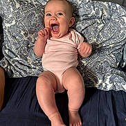 Willow joined the competition — help win amazing prizes! baby, infant, pink_onesie, smiling, happy, lying_down, pillow, patterned_pillow, bed, bedding, blue_bedsheet, skin, face, mouth_open, toes, legs, arms, head, cute, cheerful