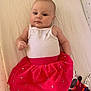 Maya participe au concours pour gagner de l'argent avec cette photo : baby, child, infant, skirt, white_tank_top, plush_toy, smiling_toy, pink, red, stars, lying_down, bed_sheet, cute, indoors, soft_toys, clothing, face, person, happy, relaxed