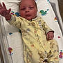 Kamron joined the competition — help win amazing prizes! baby, newborn, hospital, bassinet, blanket, duck_pattern, yellow_onesie, cartoon_characters, infant, medical_wires, sock, striped_sock, hand_raised, lying_down, cute, small, patient, cute_baby, child, portrait