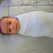 Damian joined the competition — help win amazing prizes! baby, bed, blanket, child, comfort, cute, eyes, face, head, indoors, infant, lying_down, newborn, peaceful, portrait, resting, sleeping, soft, swaddle, young