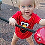 blue_eyes, child, daylight, elmo, fun, grip, happy, outdoor, park, person, play, playground, red_clothing, rope, shoes, short_hair, smiling, standing, toddler, toy
