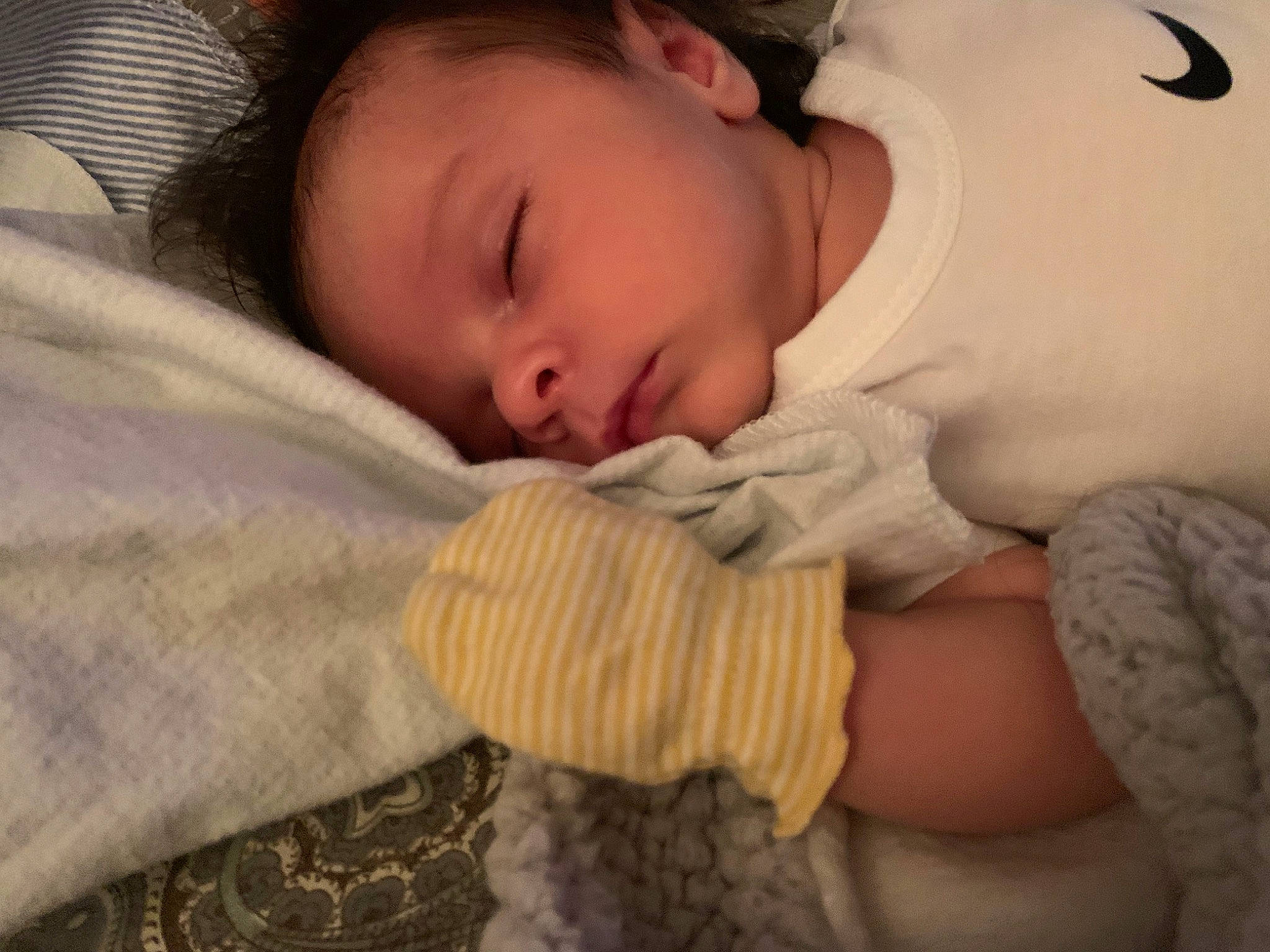 Jamari is registered to the contest to win money with this photo: baby, baby_products, baby_sleeping, baby_toddler_clothing, bedtime, cheek, child, close_up, comfort, eyelash, face, gesture, hand, linens, nose, pattern, person, skin, sleeve, thumb