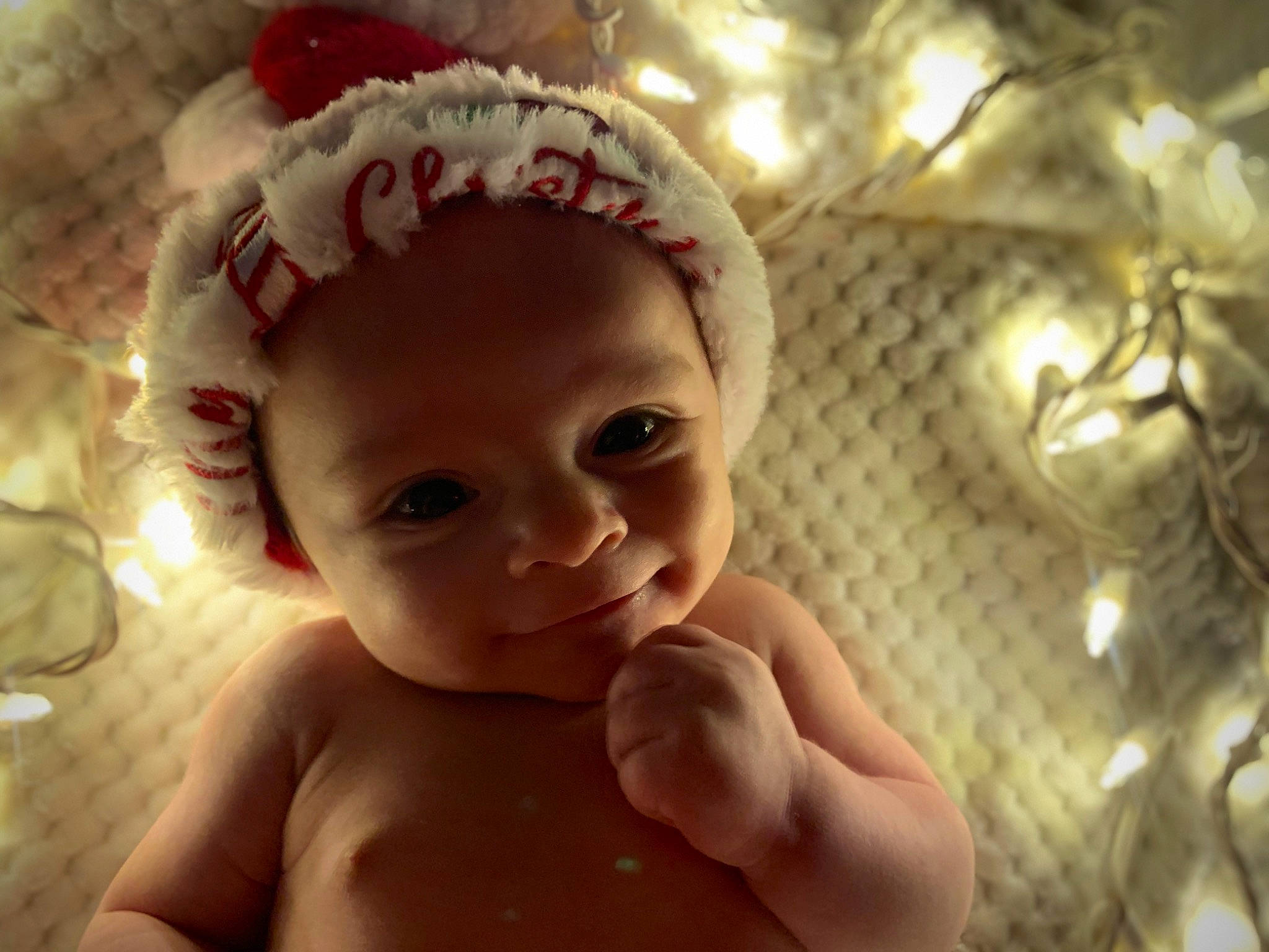 Jamari is registered to the contest to win money with this photo: arm, baby, cap, cheek, ear, eye, eyebrow, eyelash, forehead, gesture, happy, head, iris, lip, mouth, neck, nose, organ, person, skin