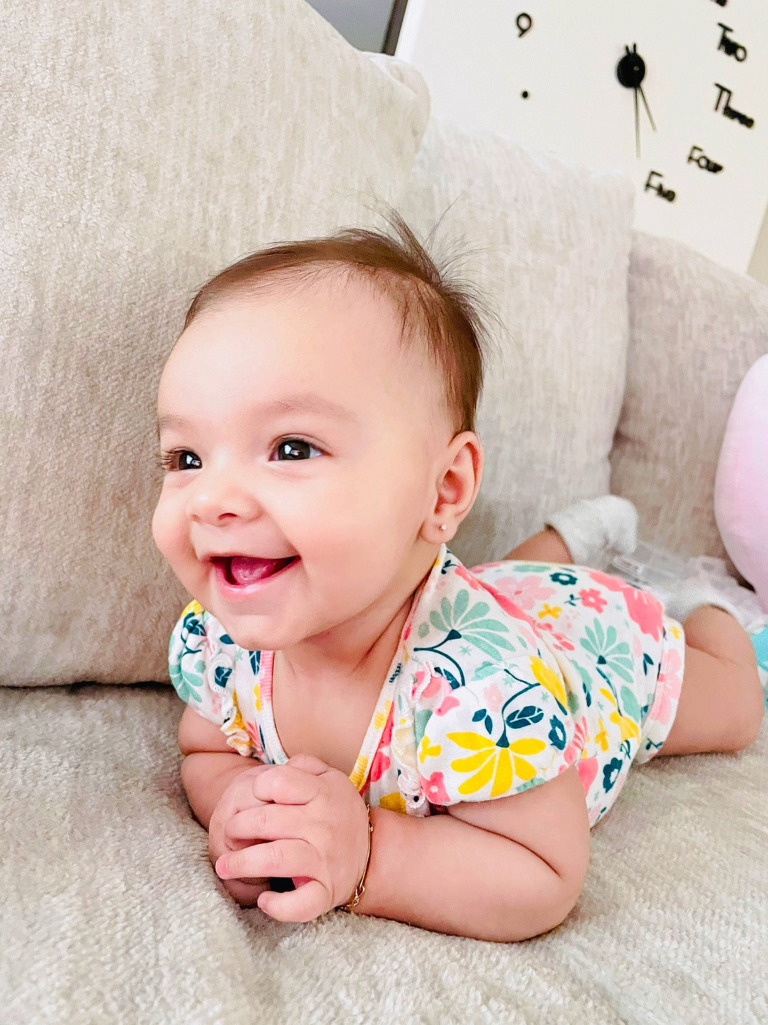 Isabella is registered to the contest to win money with this photo: baby, baby_products, baby_toddler_clothing, cheek, child, comfort, eye, finger, fun, happy, joy, linens, neck, pattern, person, pink, sitting, skin, sleeve, smile