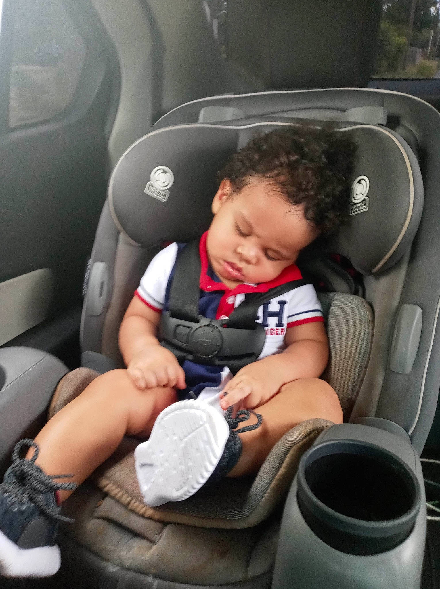 Logan is registered to the contest to win money with this photo: auto_part, baby, baby_in_car_seat, car, car_seat, car_seat_cover, child, comfort, family_car, person, product, seat_belt, toddler, vehicle