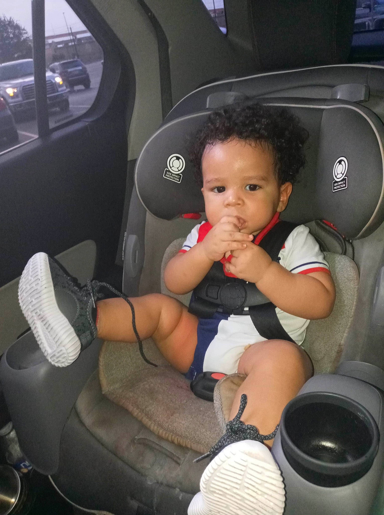 Logan is registered to the contest to win money with this photo: auto_part, baby, baby_in_car_seat, car, car_seat, car_seat_cover, child, city_car, family_car, person, product, toddler, vehicle