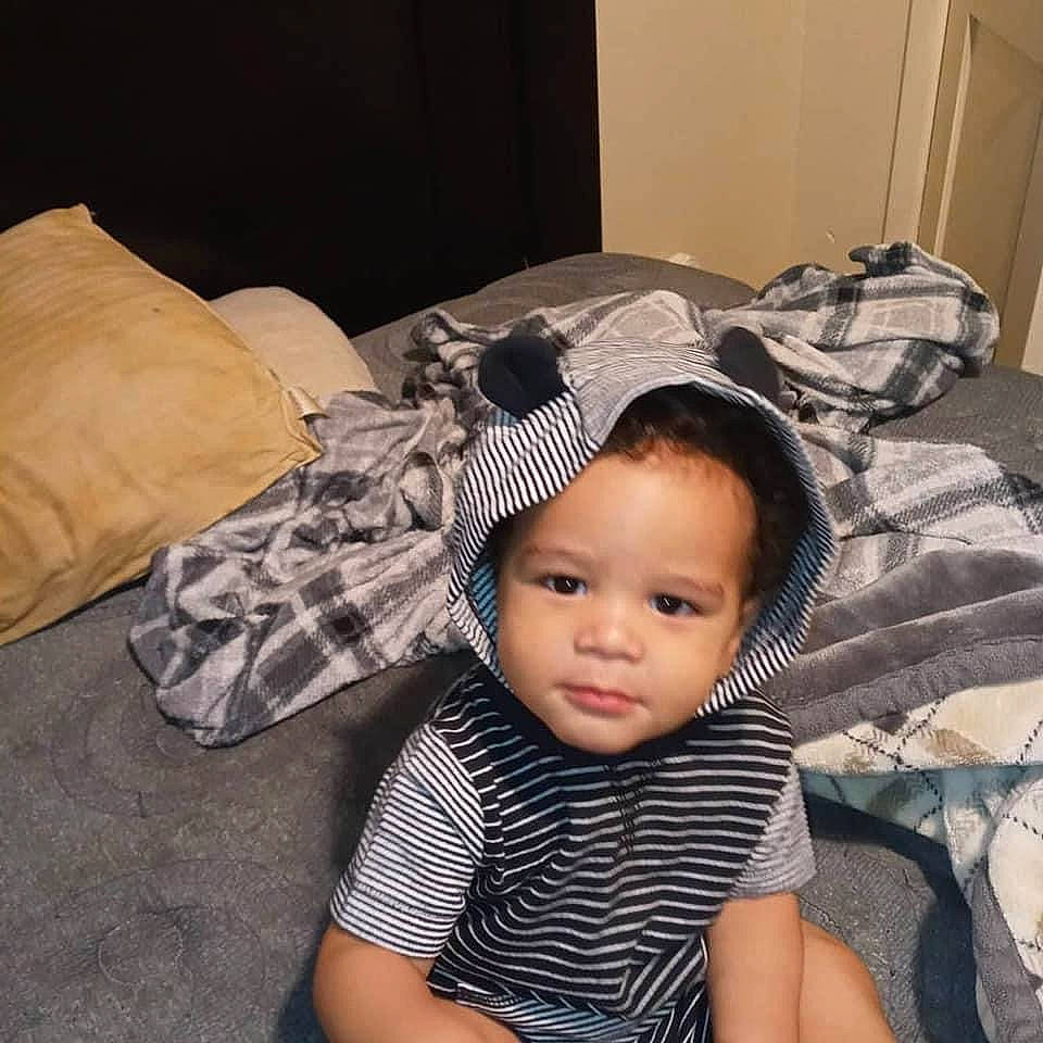 Logan joined the competition — help win amazing prizes! baby, bonnet, cap, child, cool, ear, hat, head, headgear, person, toddler