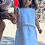 Marta joined the competition — help win amazing prizes! man, child, girl, white_dress, holding_hands, sidewalk, outdoor, smiling, beard, shoes, bicycle, red_mailbox, tree, urban, daylight, casual_clothing, person, curly_hair, public_space, street