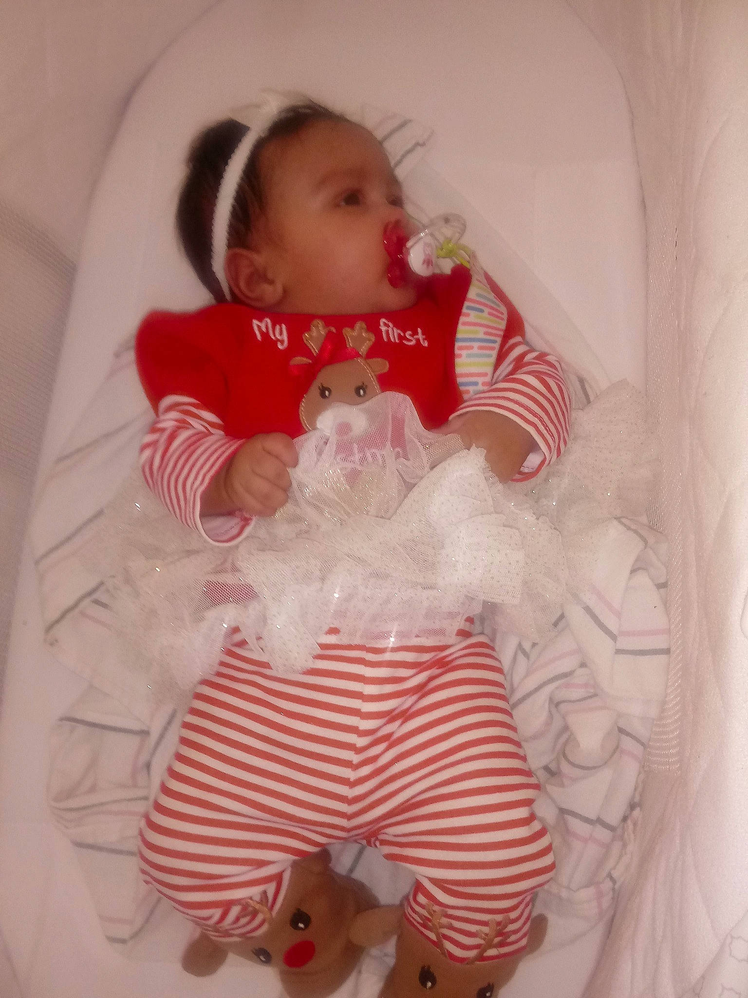 Charlene is registered to the contest to win money with this photo: baby_products, cheek, child, doll, finger, girl, hair_accessory, human_hair_color, infant, iris, mouth, person, pink, product, red, skin, textile, toddler