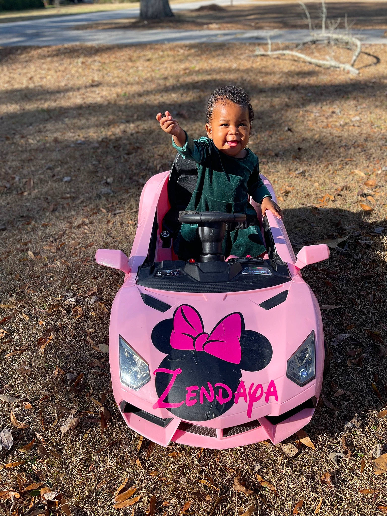 Zendaya joined the competition — help win amazing prizes! auto_part, automotive_design, automotive_exterior, automotive_lighting, automotive_tire, automotive_wheel_system, bumper, eyewear, grass, head, hood, leisure, magenta, motor_vehicle, person, pink, plant, rim, smile, tree