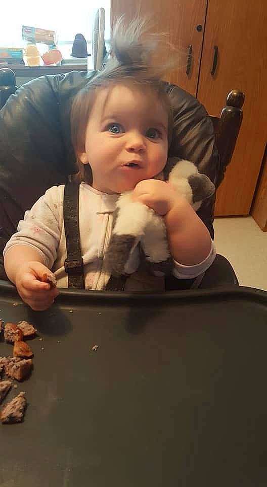 Adilena is registered to the contest to win money with this photo: baby, cheek, child, comfort_food, cuisine, eating, face, finger, finger_food, food, head, person, sitting, thumb, toddler, vacation
