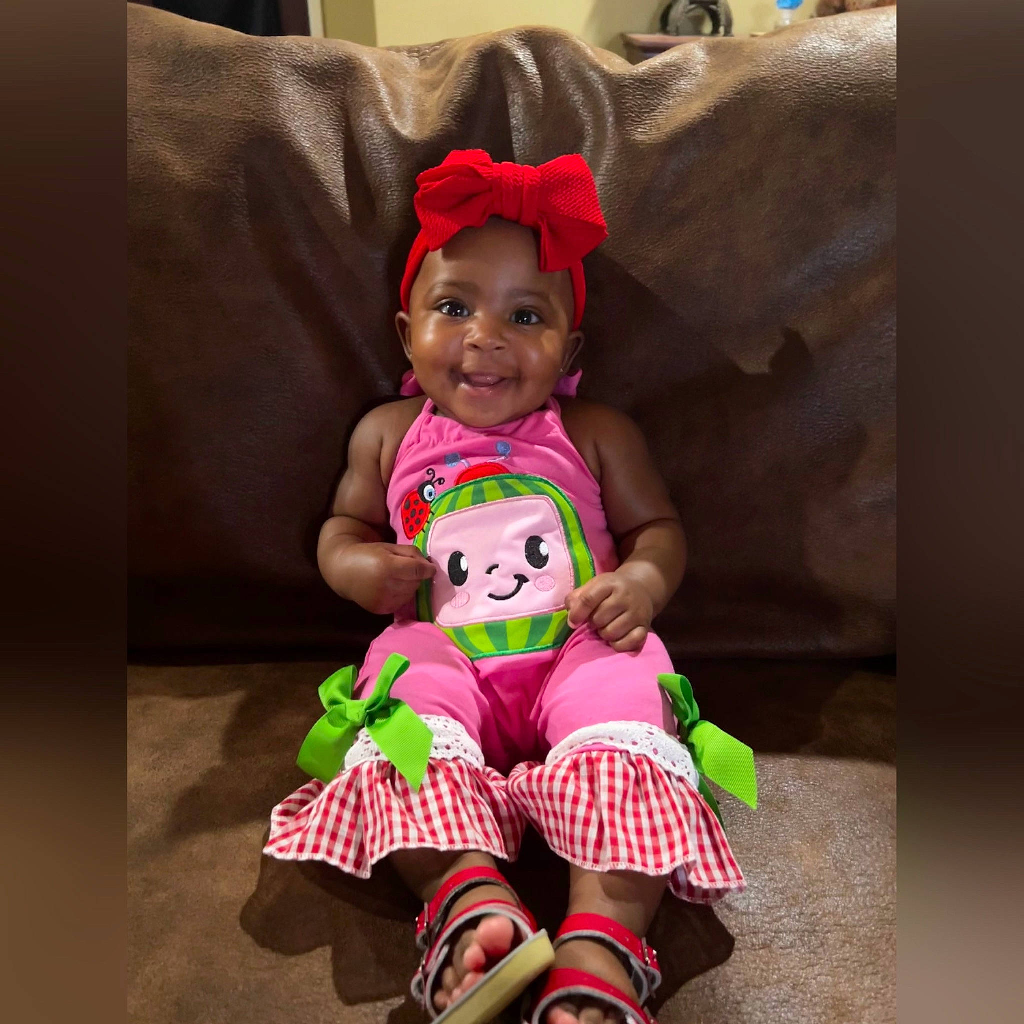 My'Lani is registered to the contest to win money with this photo: baby, baby_toddler_clothing, cool, couch, dress, eye, face, fun, happy, head, joy, magenta, pattern, person, pink, play, selfie, sitting, sleeve, smile