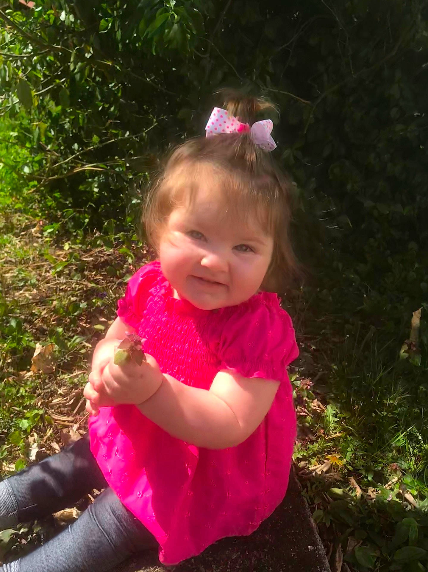 Delilah is registered to the contest to win money with this photo: child, day, fun, girl, grass, hair_accessory, happiness, infant, iris, magenta, person, pink, plant, play, smile, spring, toddler, tree