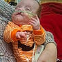 Raven is registered to the contest to win money with this photo: baby, infant, medical_tube, striped_clothing, orange, person, hand, hospital, monitor, blanket, knit_sleeve, medical_sensor, indoor, child, healthcare, newborn, resting, cute, care, small