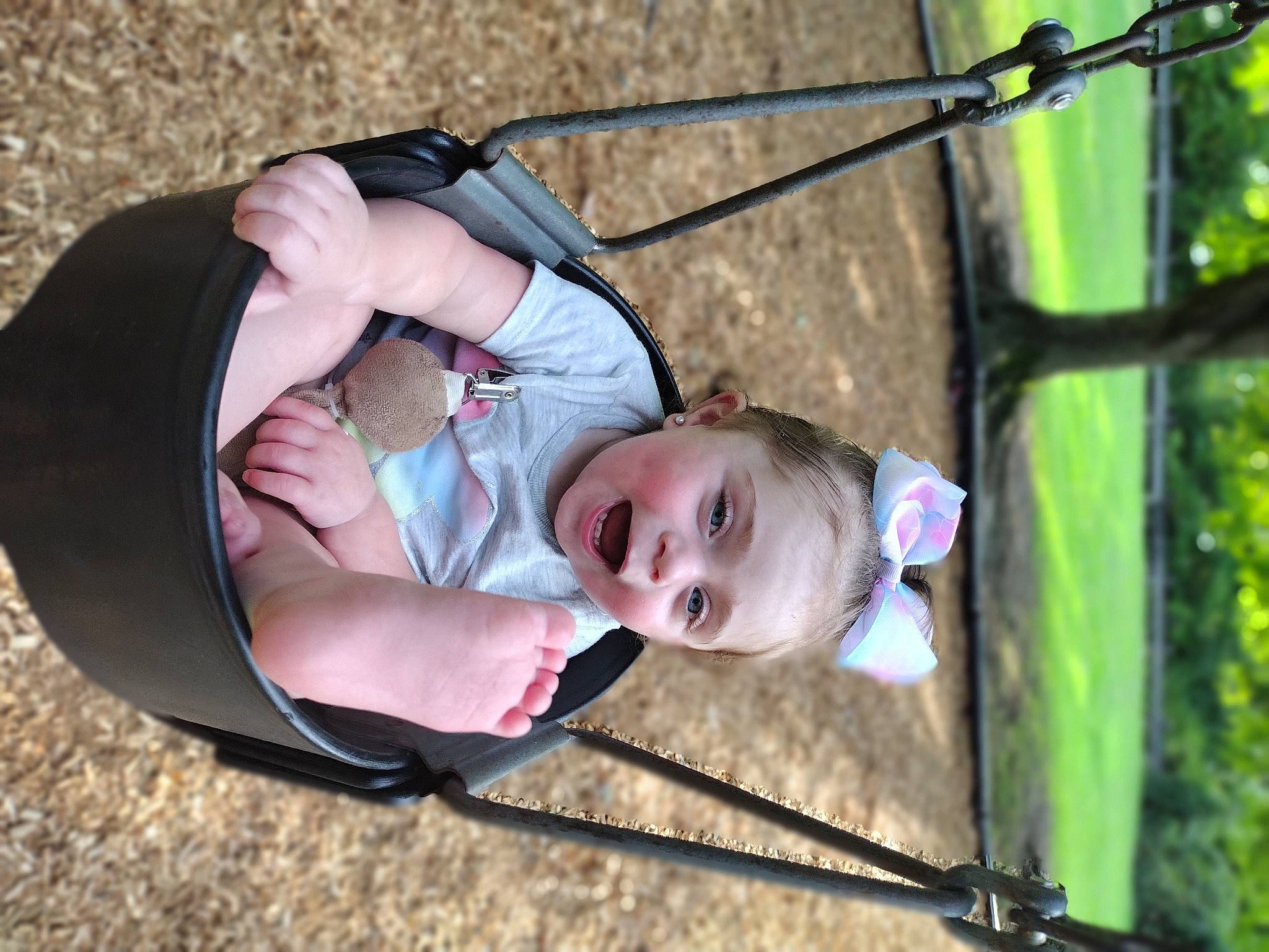 Isabelle is registered to the contest to win money with this photo: baby, beauty, child, fun, grass, hand, happy, leaf, leisure, people_in_nature, person, photograph, plant, playground, recreation, spring, swing, toddler, tree, vertebrate