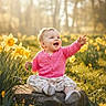baby, child, smiling, pink_sweater, flower, daffodil, nature, outdoor, grass, rock, sunlight, forest, happy, sitting, headband, cute, person, spring, daylight, portrait