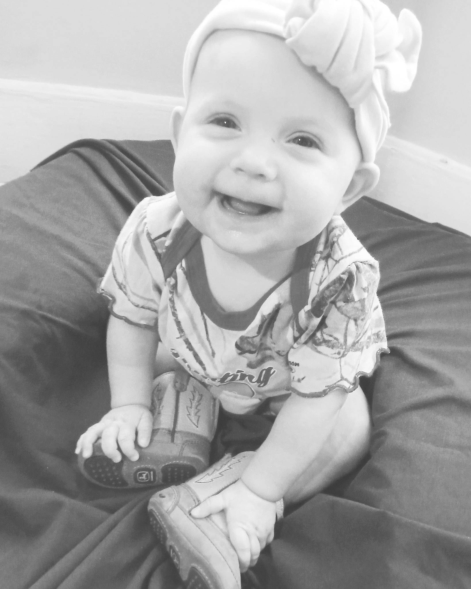 Madelyn is registered to the contest to win money with this photo: arm, baby, baby_laughing, baby_toddler_clothing, cheek, child, comfort, eye, face, finger, flash_photography, fun, happy, head, headwear, iris, joy, mouth, person, skin