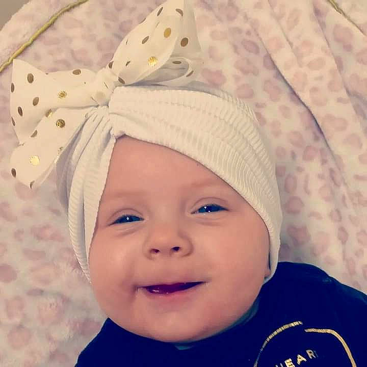 Madelyn joined the competition — help win amazing prizes! baby, baby_laughing, baby_sleeping, baby_toddler_clothing, beanie, cap, costume_hat, electric_blue, face, fashion_accessory, hair_accessory, happy, headgear, headwear, knit_cap, pattern, person, sleeve, smile, textile